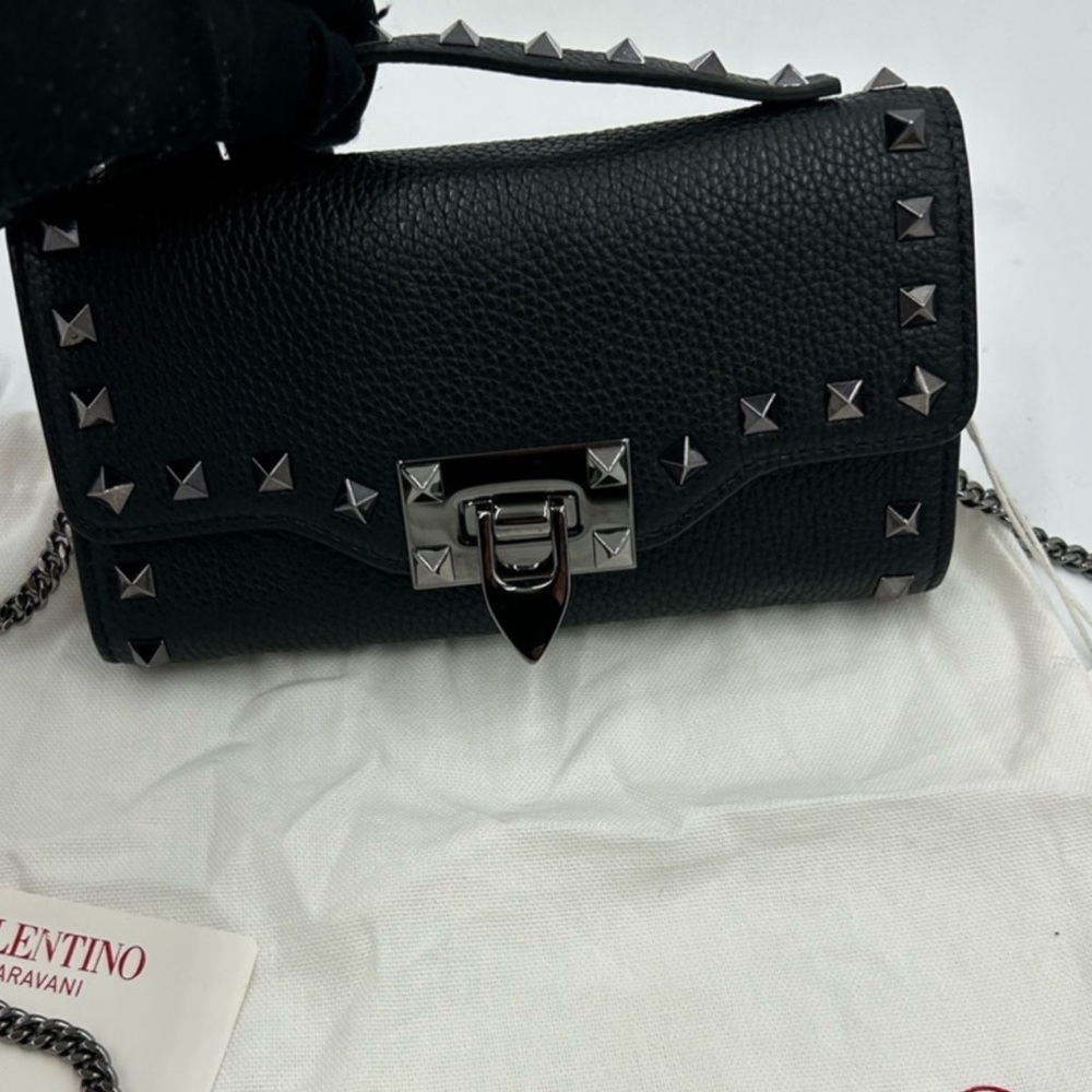 Valentino Garavani Rock stud wallet on a chain .